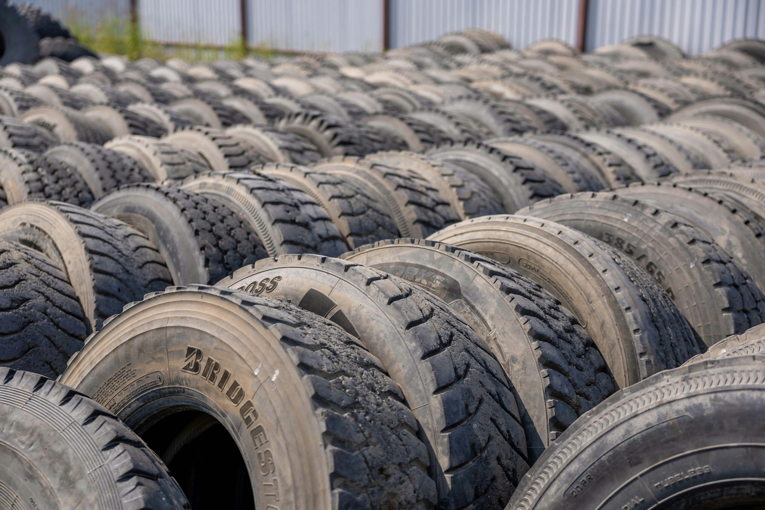 Rows of truck tires in an outdoor storage lot